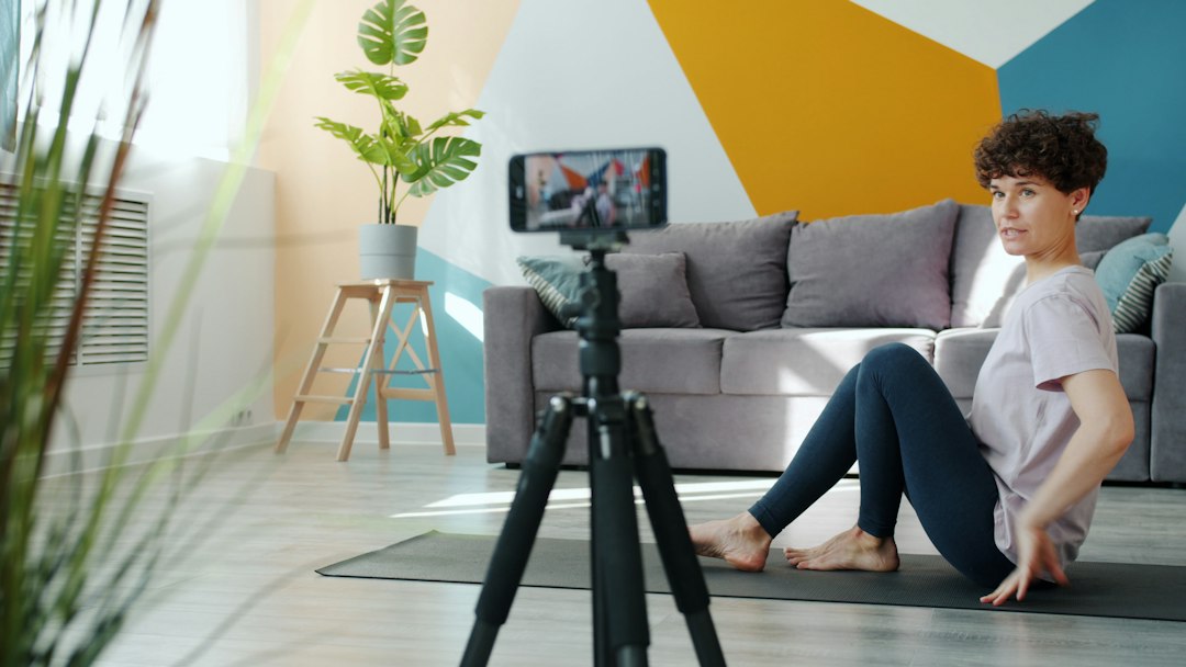 Woman exercising in front of a smartphone camera