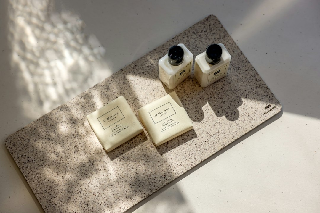 Bathroom toiletries rest on a textured mat