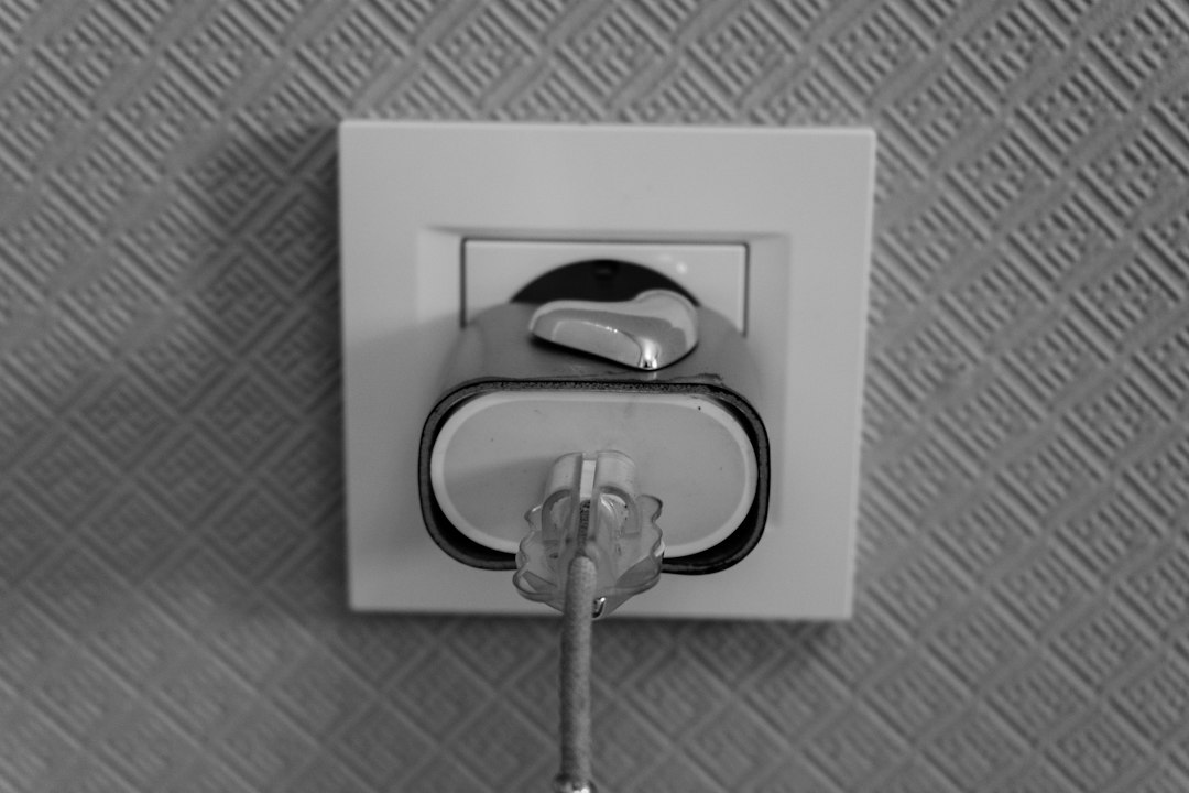 A plug inserted into a wall socket